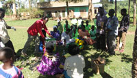 Micheal giving out crop sprayers funded by ALLHIM donations to community groups